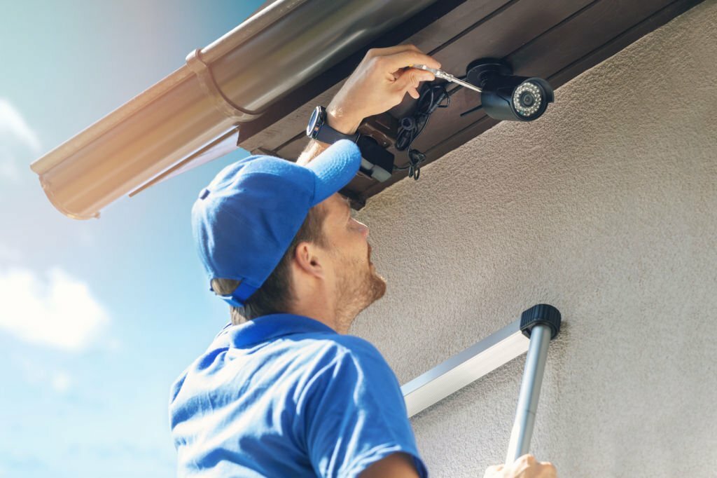 man install outdoor surveillance camera for home security